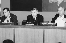 Chairman David Koon joins Assembly Environmental Conservation Committee Chair Richard Brodsky at the public hearing held to review the Superfund audit conducted by Comptroller Carl McCall (foreground).