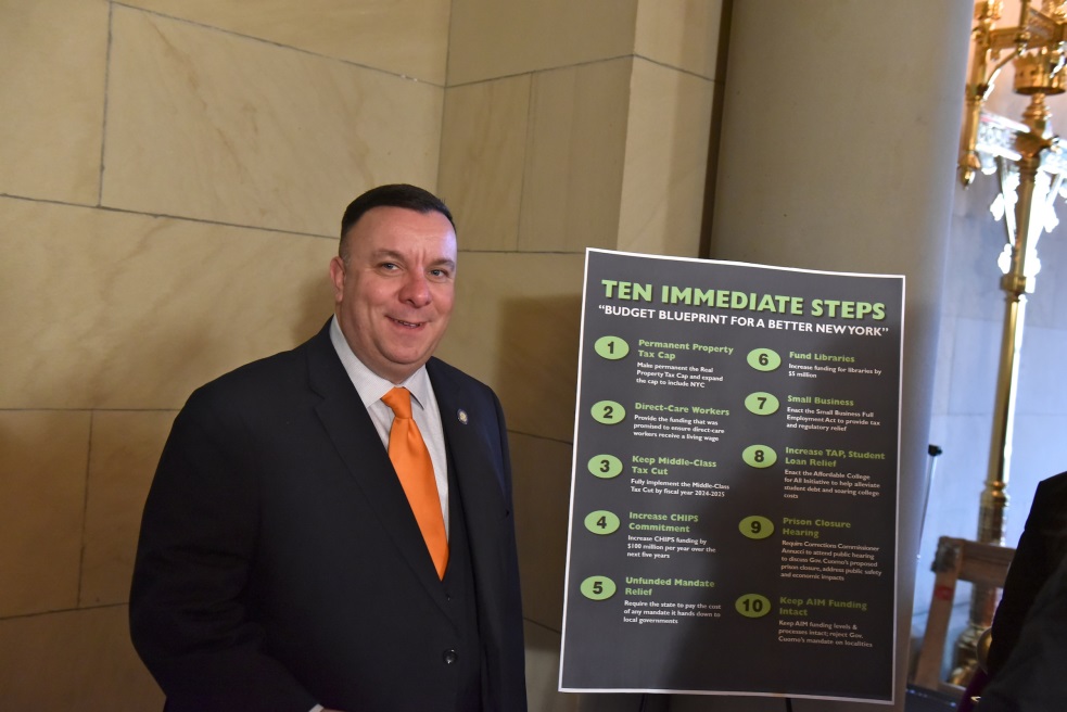 Assemblyman Brabenec poses with the Assembly Minoritys Budget Blueprint for a Better NY
